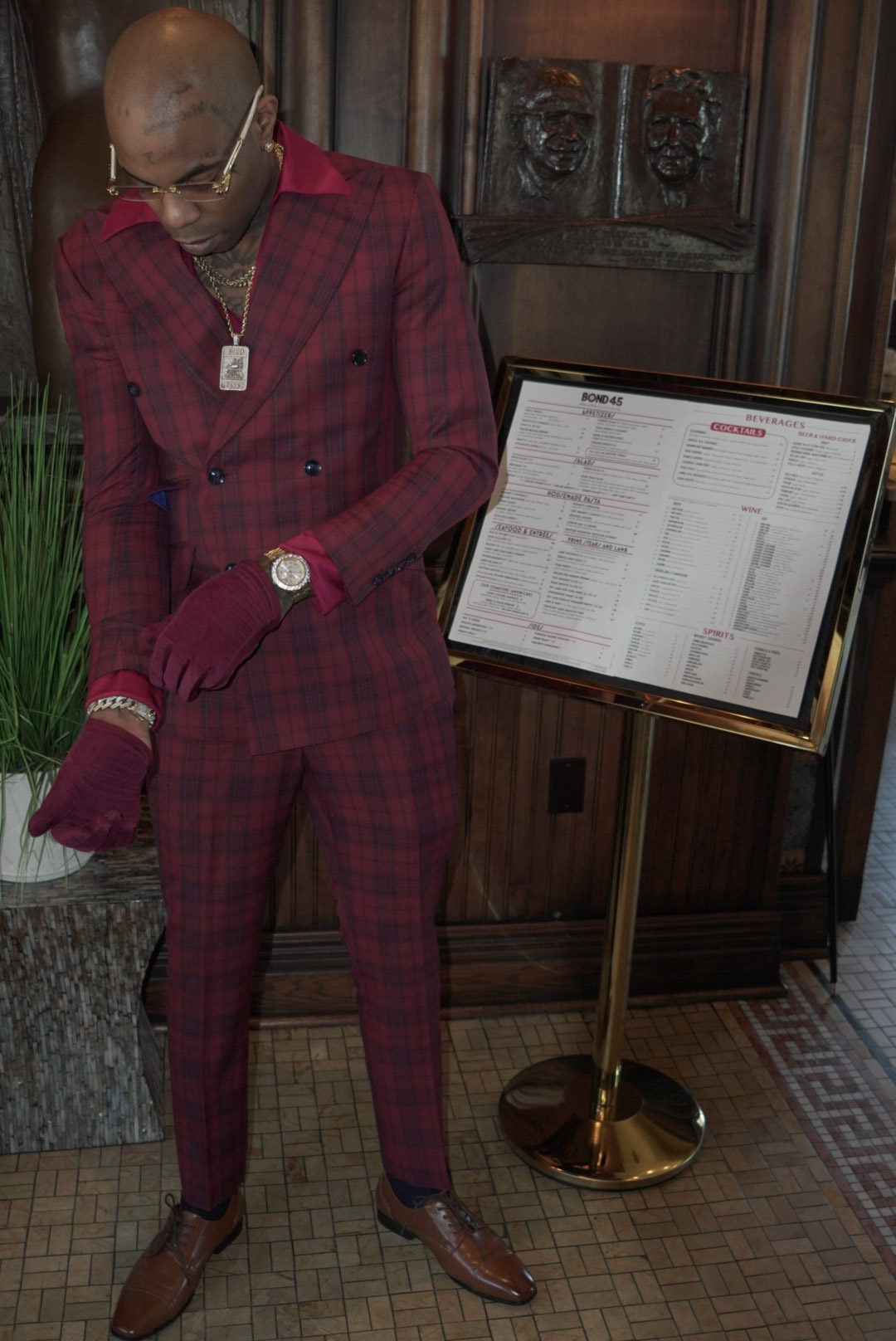 Red plaid suit, gloves and gold watch detail