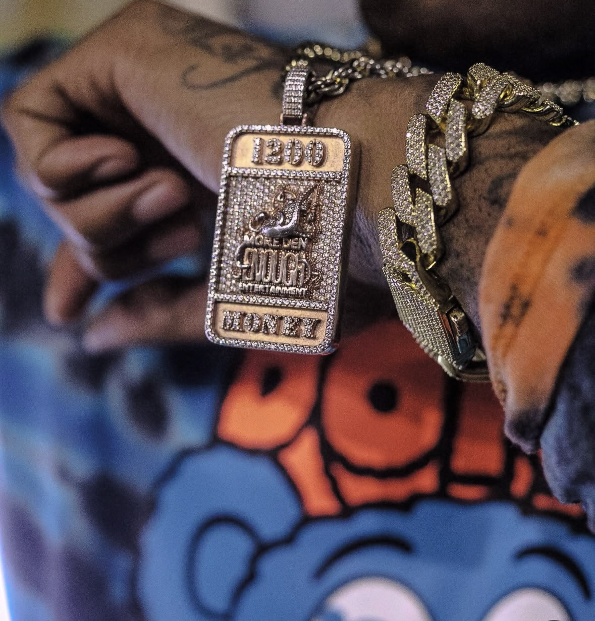 MDE iced-out chain and pendant detail