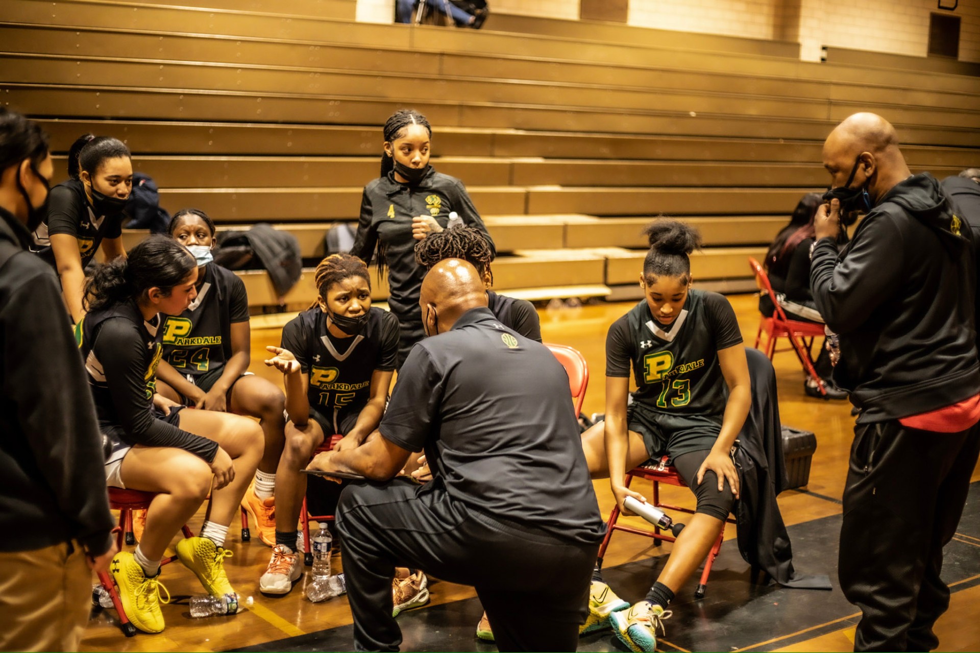 Parkdale coach drawing up the play in the huddle