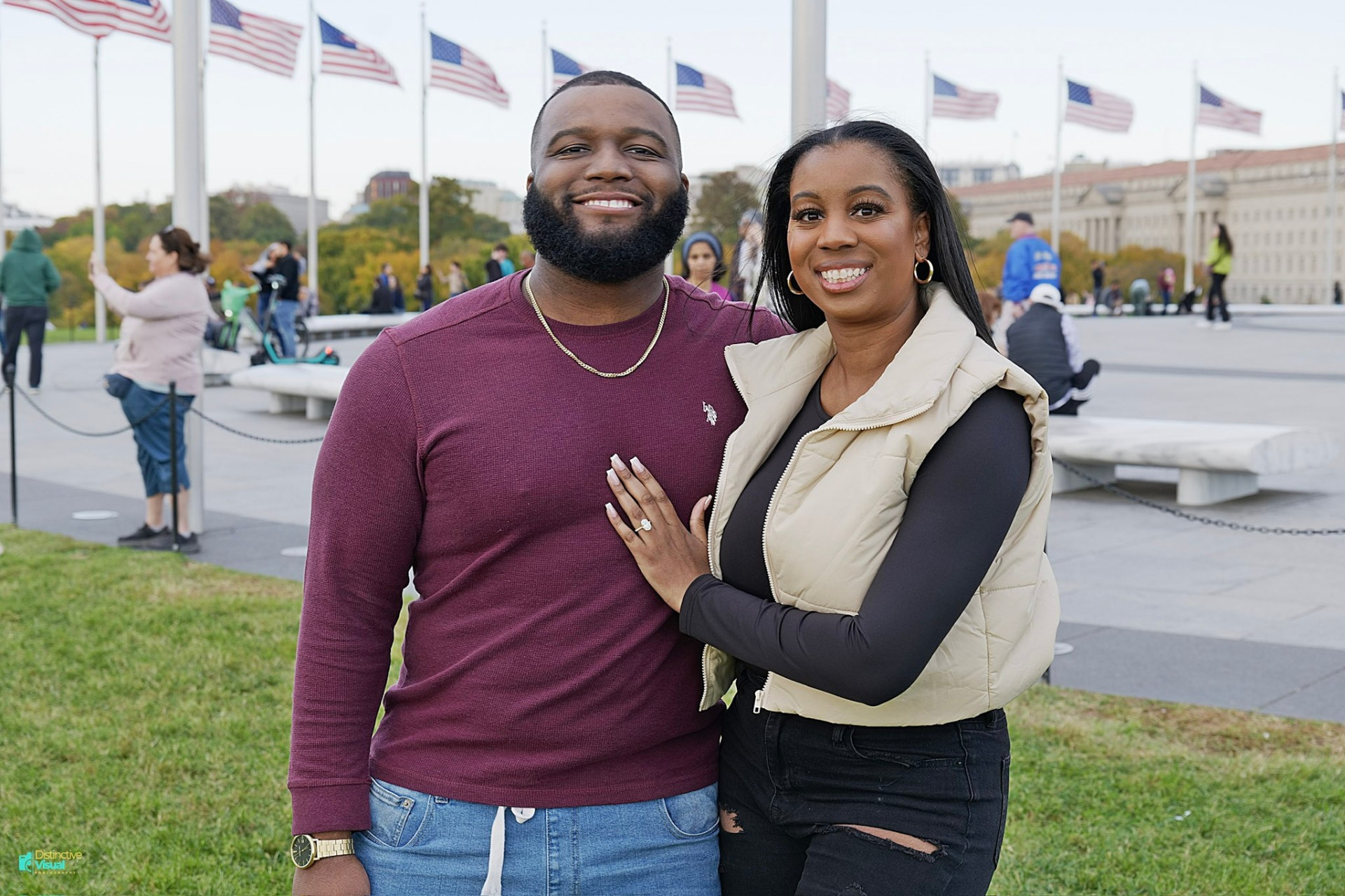 Engaged couple in front of the flags