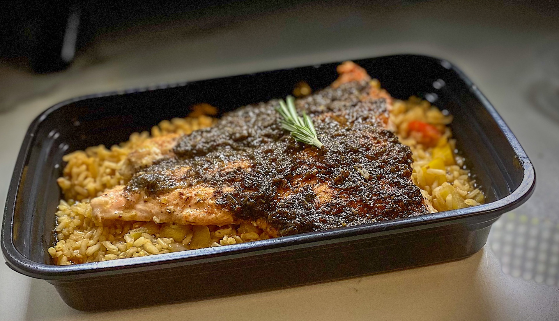 Plated salmon with rice, close food photograph
