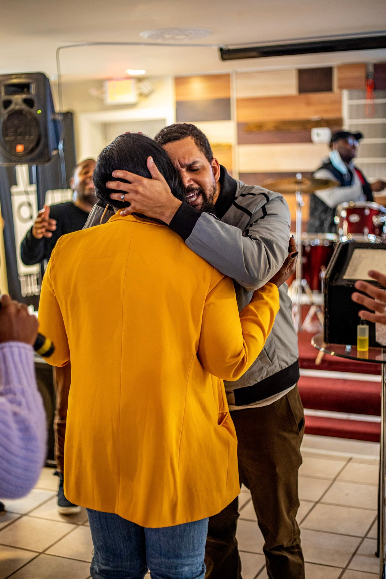 Tearful embrace during worship service