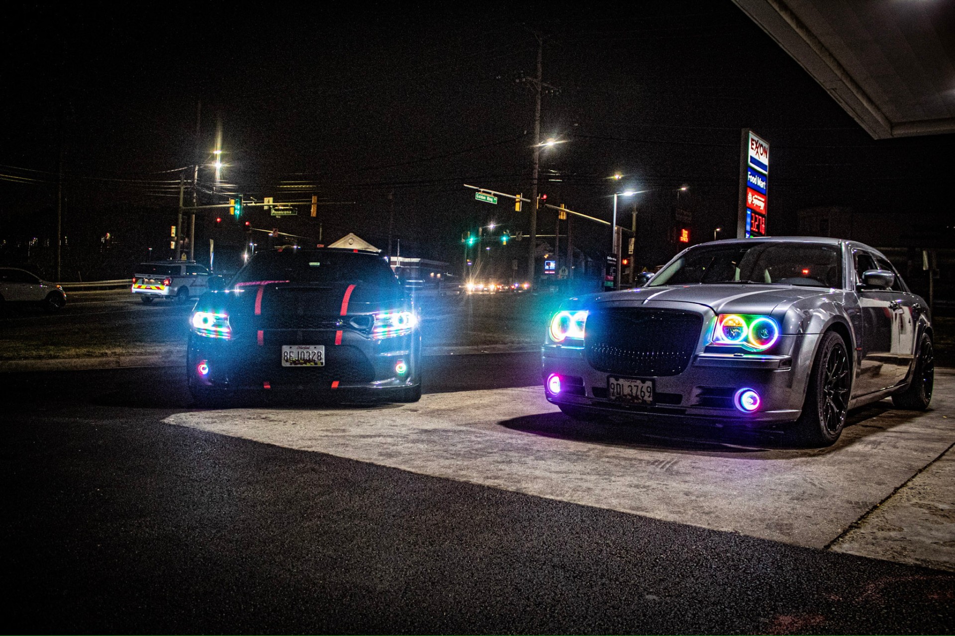 Two cars, halo headlights at night