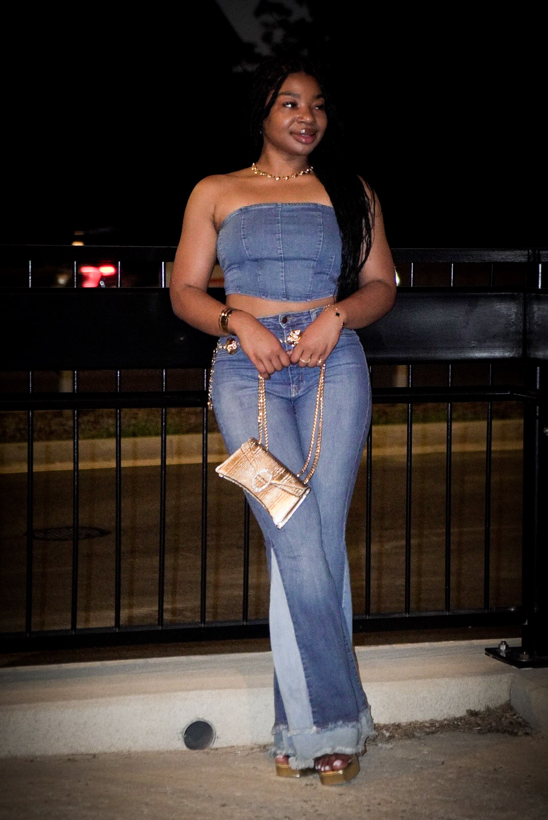 Night portrait with gold clutch